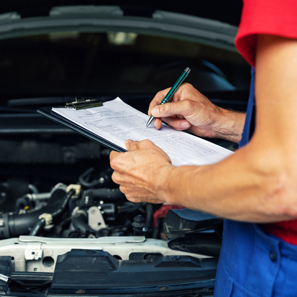 mechanic going over checklist
